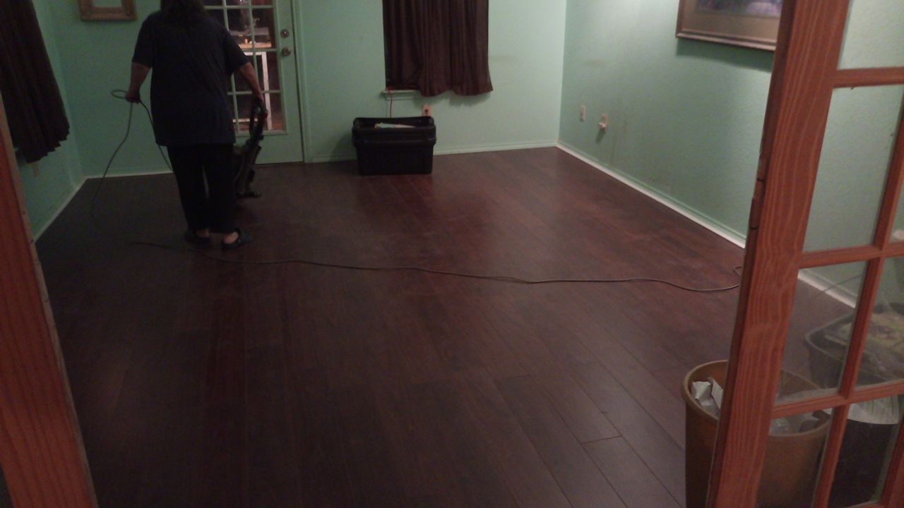 Finished dark laminate wood flooring in a living room